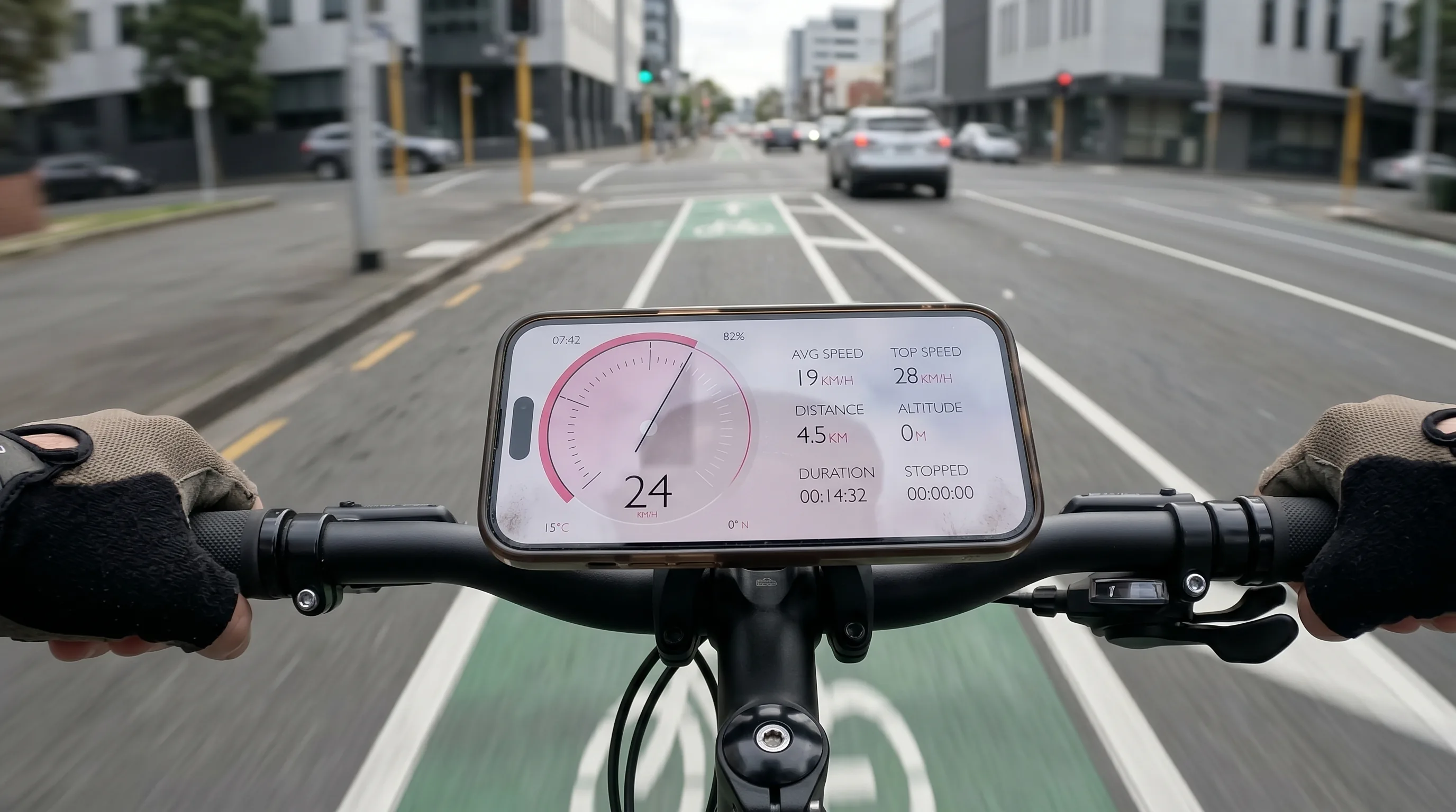GPS Speedometer running on an iPhone in a handlebar mount on a city commuter bike, urban bike lane in golden-hour morning light