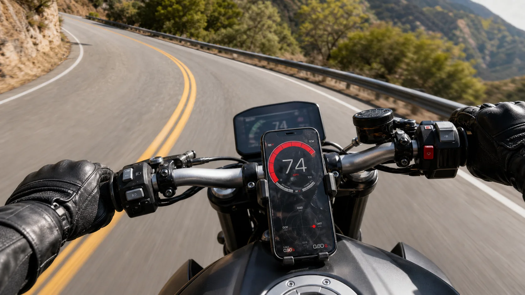 GPS Speedometer running on an iPhone in a tank-mount on a sport motorcycle, twisty mountain road curving into an apex